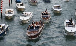 U.S. actor George Clooney travels in a taxi boat in the Grand Canal in Venice, ahead of a gala dinner